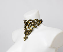 Load image into Gallery viewer, Choker necklace made from gold metallic latex to look like real metal. Composed of baroque style ornaments.