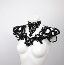 Load image into Gallery viewer, Choker necklace made from black sculpted latex. Composed of baroque style 3D ornaments. Shown with a matching shoulder piece.
