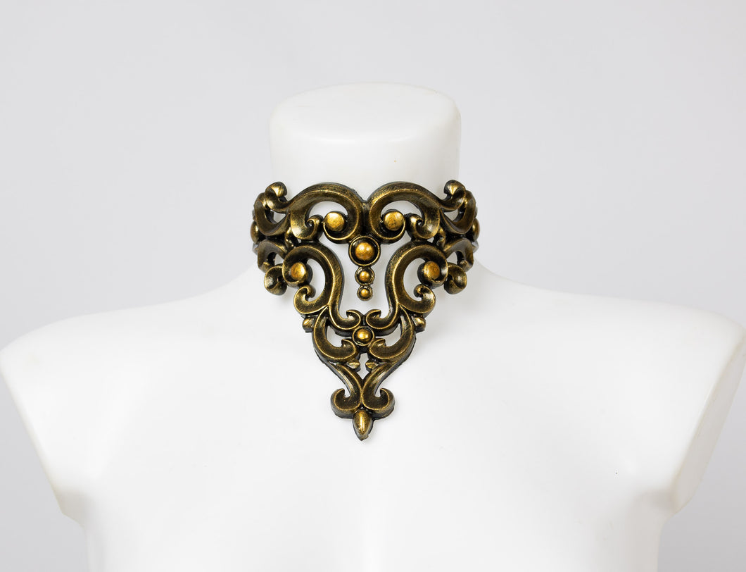 Choker necklace made from gold metallic latex to look like real metal. Composed of baroque style ornaments.