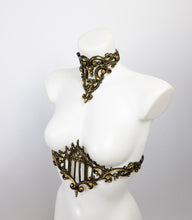 Load image into Gallery viewer, Choker necklace made from gold metallic latex to look like real metal. Composed of baroque style ornaments. Shown with a matching belt featuring a gothic cathedral window.
