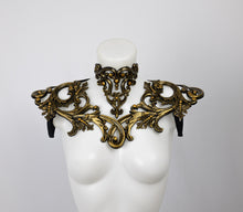 Load image into Gallery viewer, Choker necklace made from gold metallic latex to look like real metal. Composed of baroque style ornaments. Shown with a matching shoulder piece.
